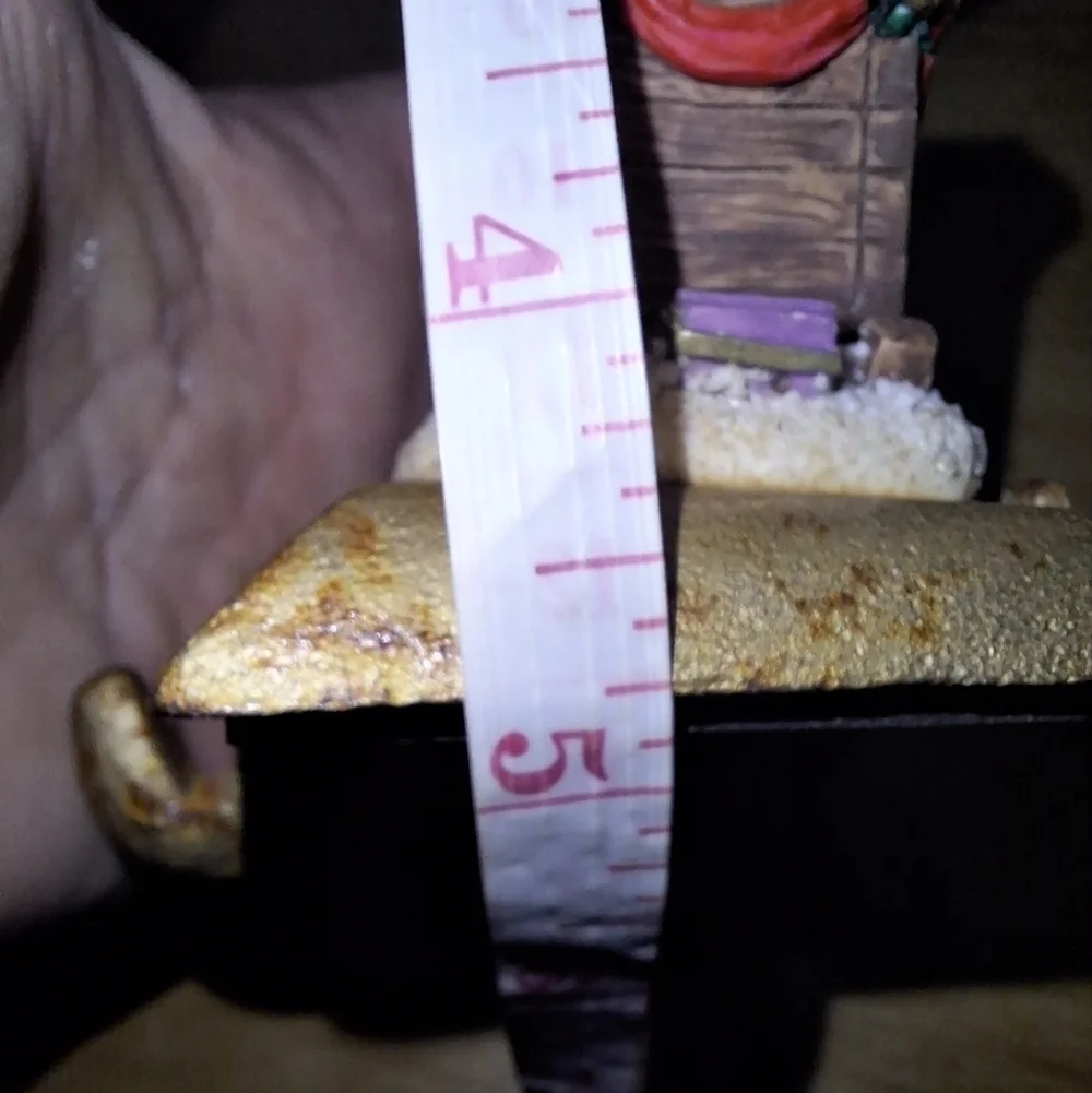 An unbranded Mouse and sleigh stocking holder. The base is 3.75